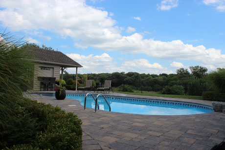 The home owner had installed an in ground pool in his backyard and had wanted us to build the patio around the pool using interlocking stone. We agreed to do it and here is one photo of the finished product. 